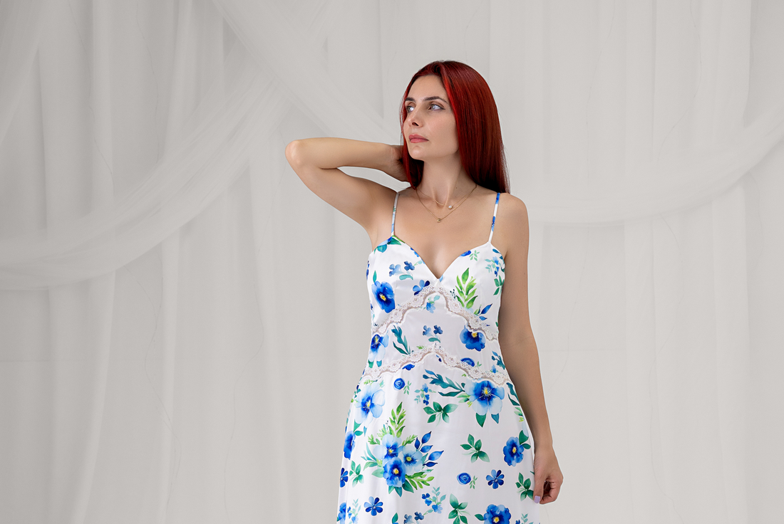 Azure Bloom white floral maxi dress with blue flowers and green leaves, full-length front view